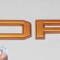 FORD RANGER 

GRILL LETTERS

   'F-O-R-D'

ORANGE LETTERS
