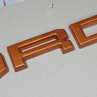 FORD RANGER 

GRILL LETTERS

   'F-O-R-D'

ORANGE LETTERS