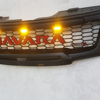 NISSAN NAVARA D40 FACELIFT COMPLETE GRILL RED LOGO/AMBER LEDS