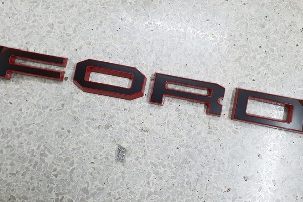 FORD RANGER 

GRILL LETTERS

   'F-O-R-D'

RED/BLACK  LETTERS