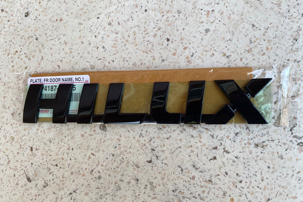 TOYOTA HILUX 2015-2024 GENUINE DOOR LOGO'S L/R