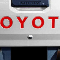 TOYOTA HILUX 2026 TAILGATE LOGO ABS MATT BLACK/GLOSS BLACK/WHITE/RED